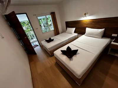 Budget Twin Room with Fan — Coco's Guest House